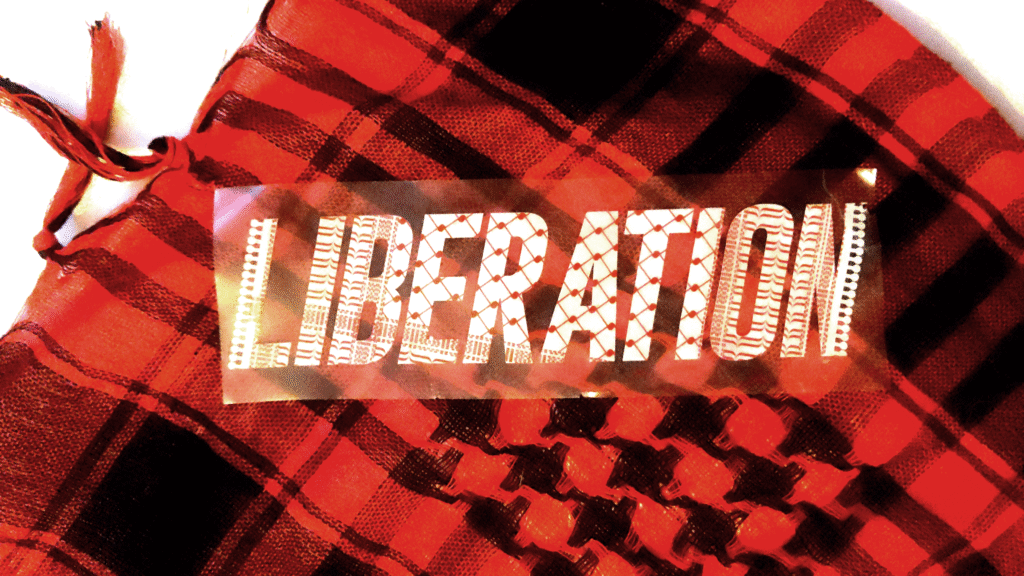 A red and black hipster keffiyeh. with a sticker of the word "Liberation," white and red in traditional Palestinian keffiyeh pattern on a clear background.