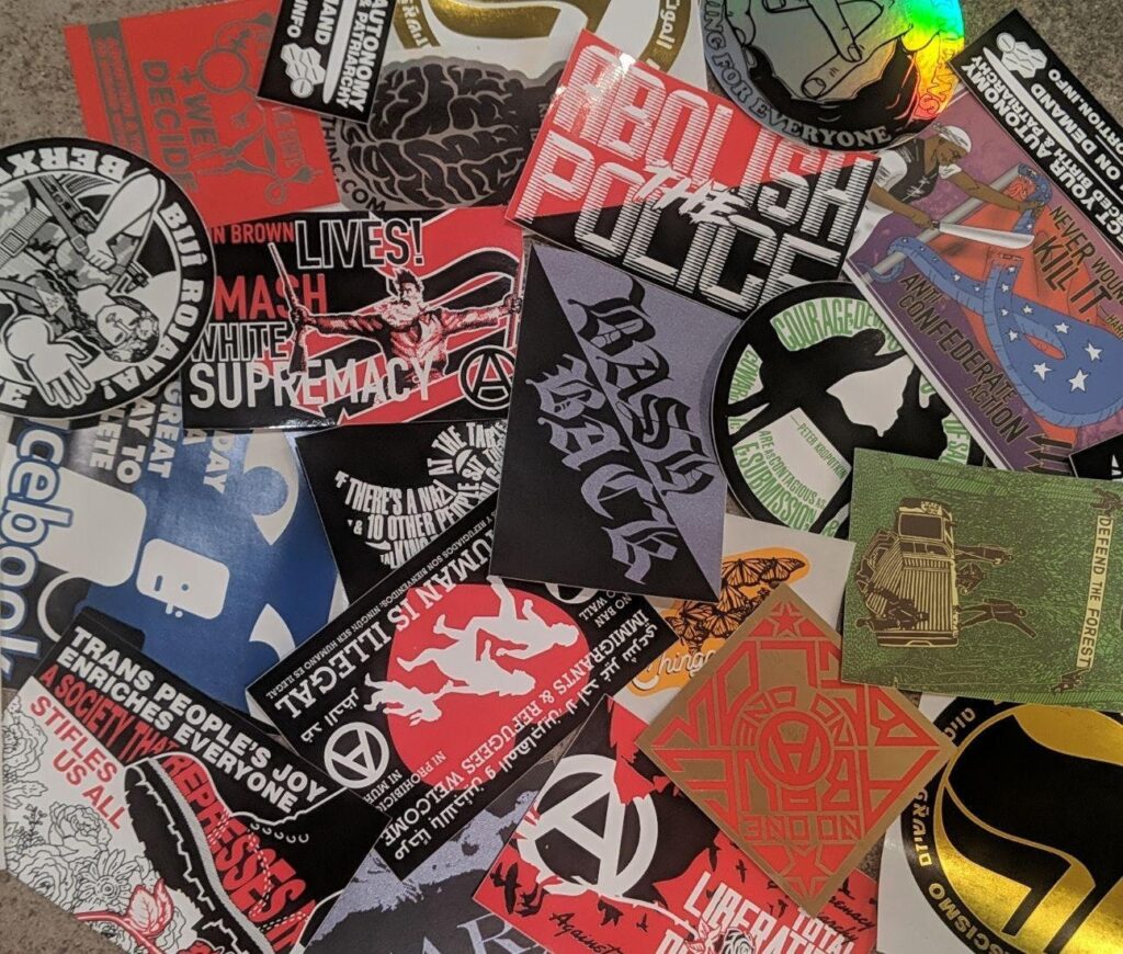 A messy pile of multiple Municipal Adhesives stickers
